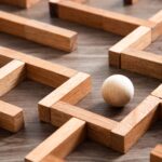 A wooden marble within a wooden maze