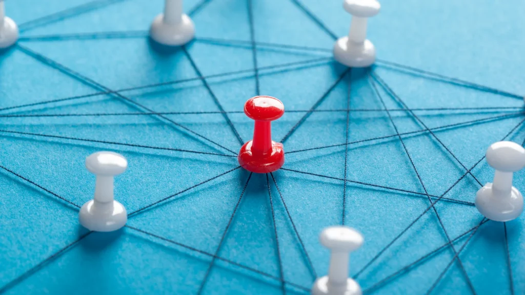 A network of push pins and string