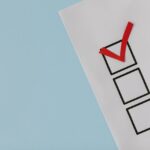 A paper showing 3 checkboxes and one checkmark