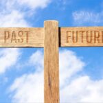 A two-directional sign with options for PAST and FUTURE