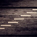 A human figure climbing steps to demonstrate growth and rehabilitation